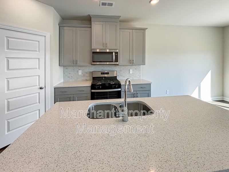 Brand-new modern home with patio, perfect for entertaining property image